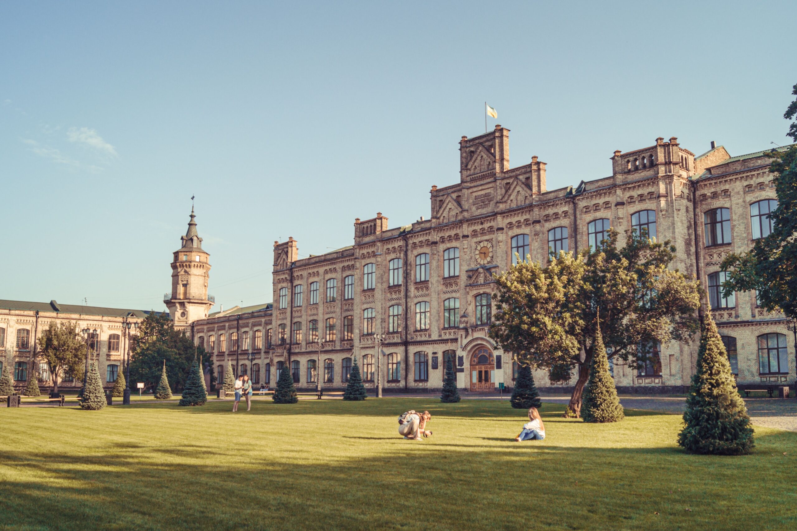 Academic institution building with staff walking outside